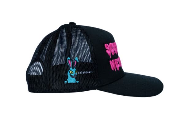 A black hat with a pink bunny on it