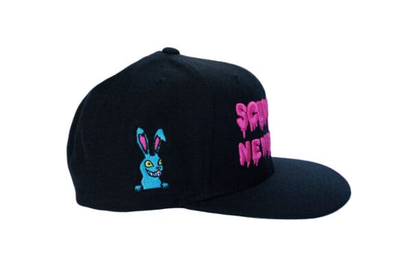 A black hat with a pink bunny on it