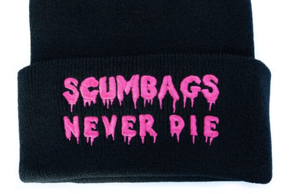 A close up of the words " scumbags never die ".